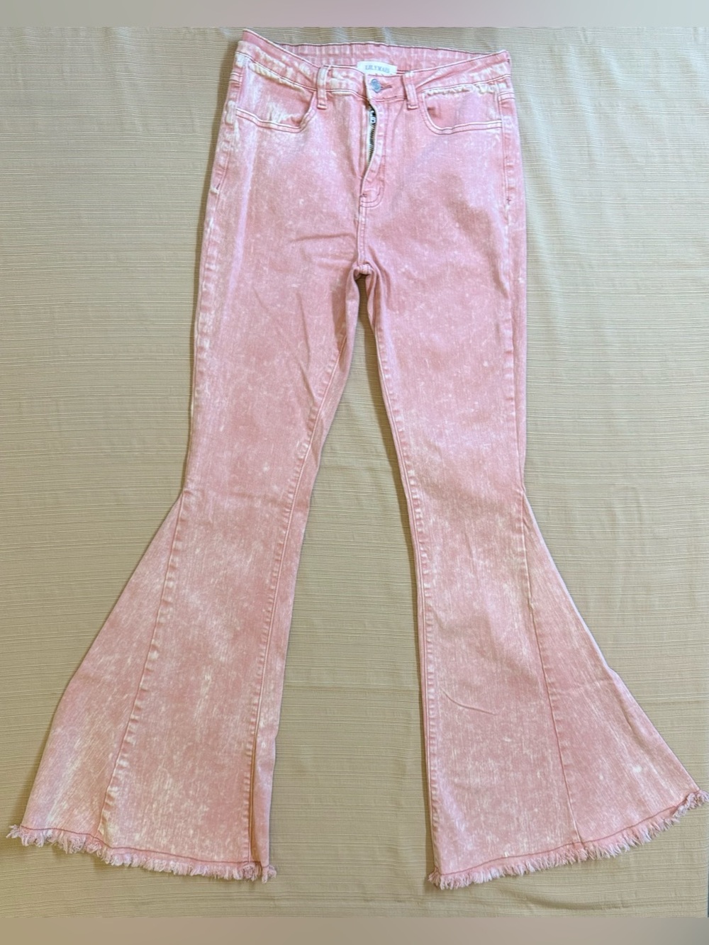 Pink acid wash flare jeans by LilyMae’s